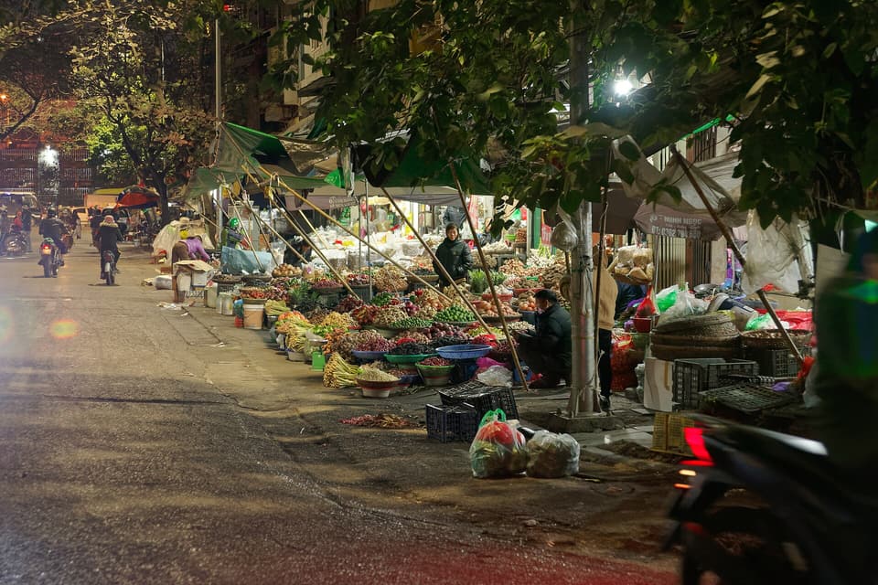 Night produce stalls lining a street in Hanoi's Old Quarter